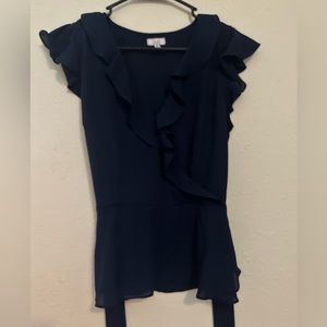 NWOT navy blue blouse. Tie detail around waist. Size medium
